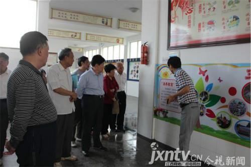 新余市关工委主任陈九根一行到西湖小学调研指
